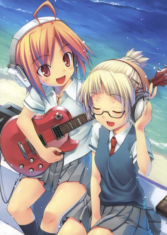 Two girls with guitars at the beach