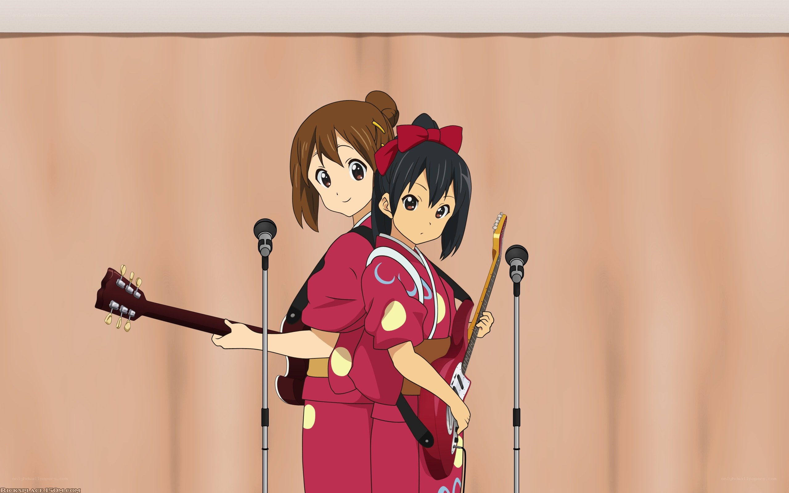 Two girls with guitars on stage