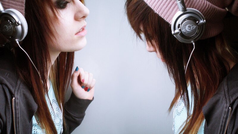 two girls with headphones