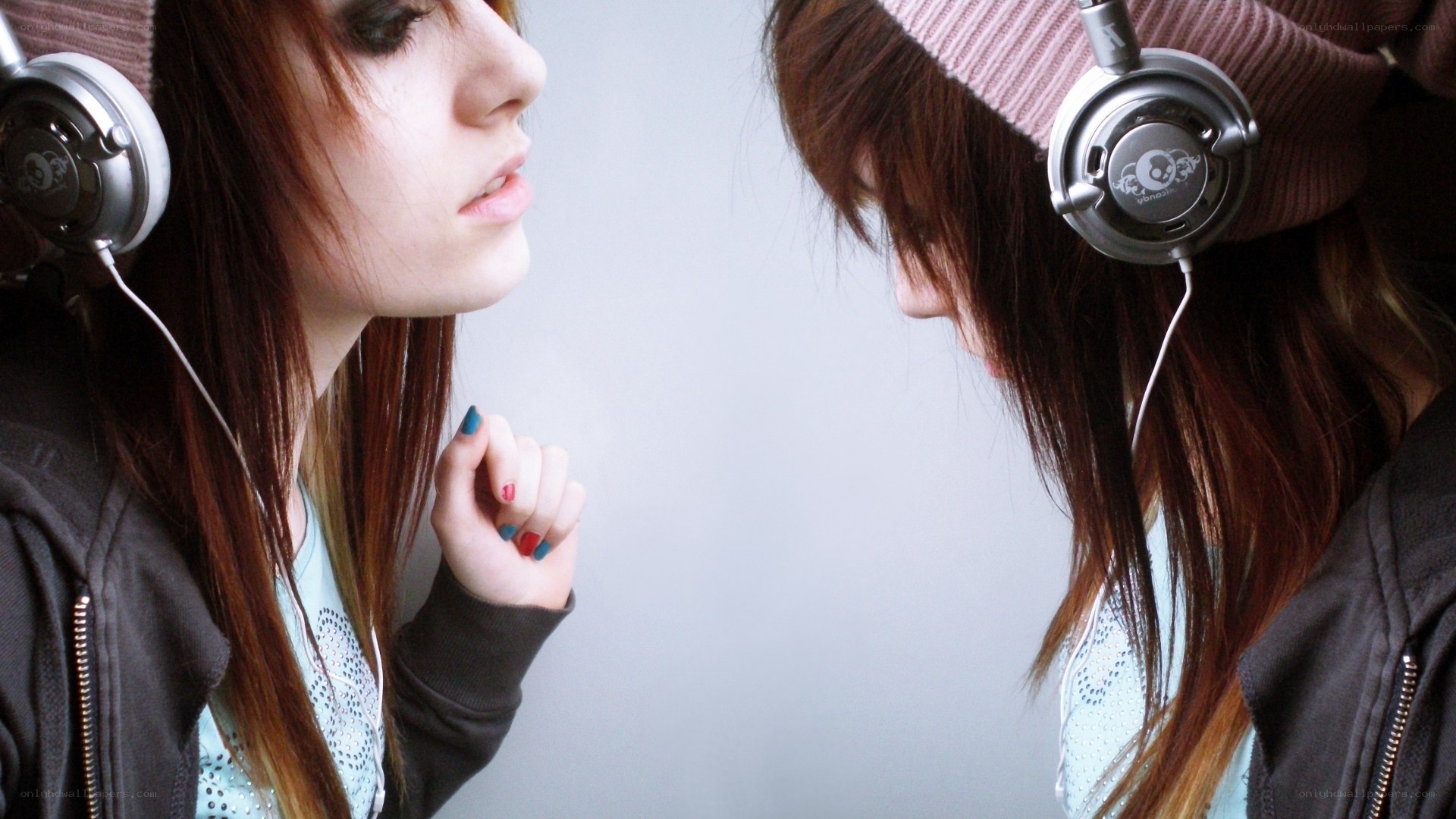 two girls with headphones