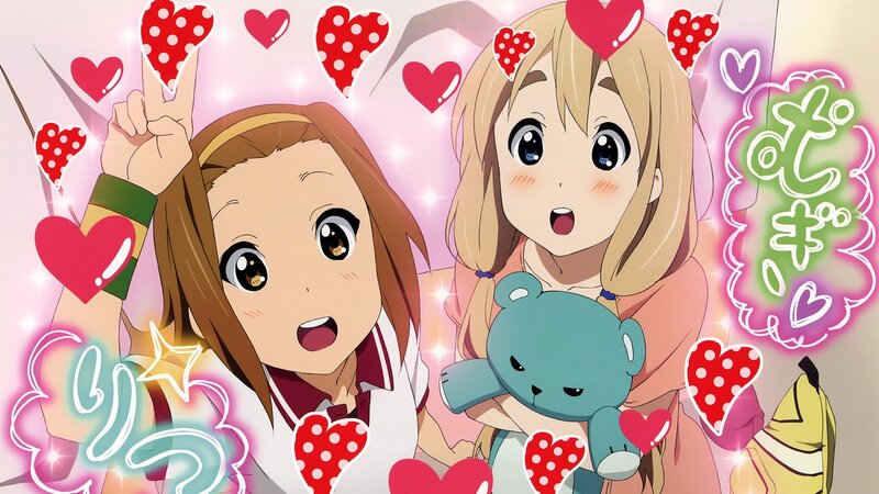Two girls with hearts and a teddy bear