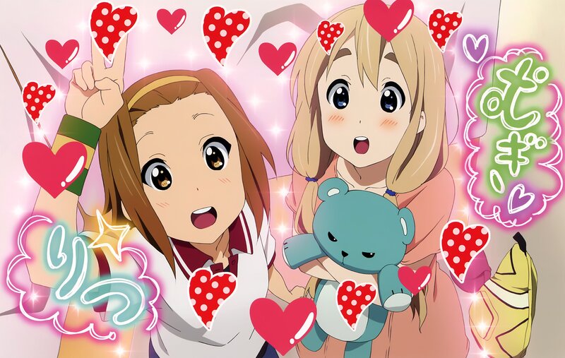 Two girls with hearts and a teddy bear