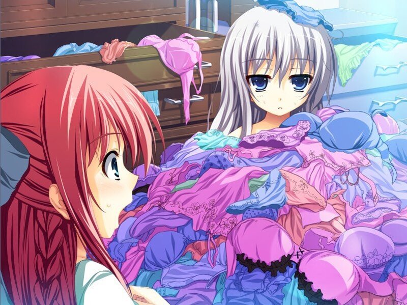 Two girls with lingerie pile