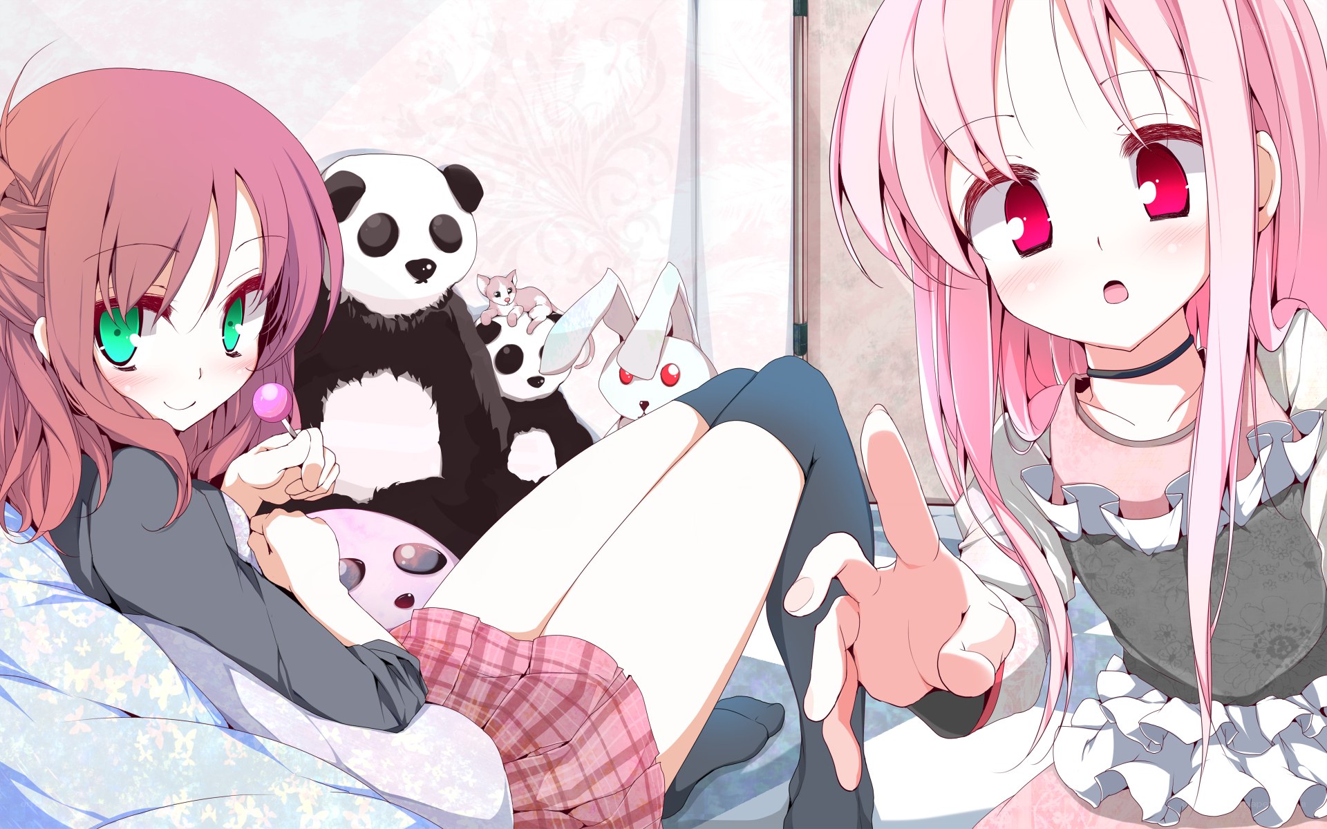 Two girls with plush toys