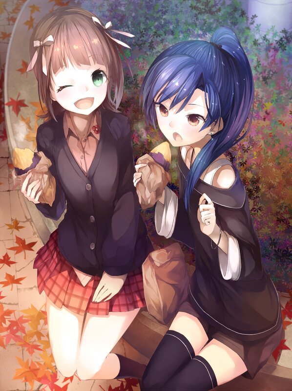 Two girls with snacks in autumn