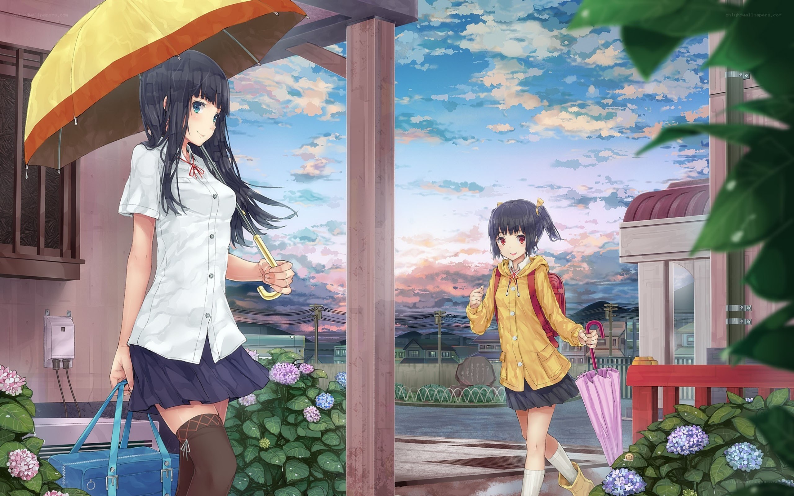Two girls with umbrellas