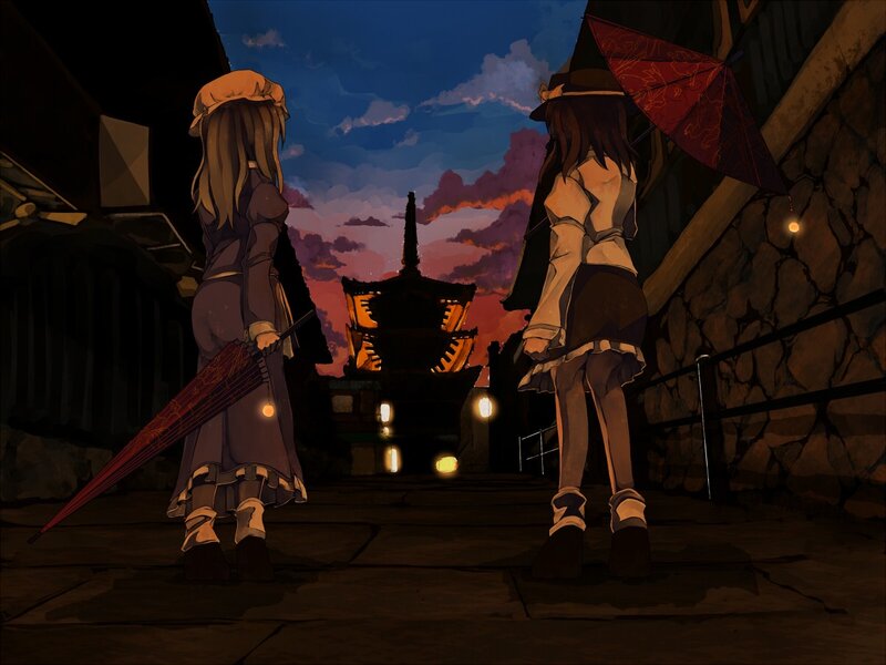 Two girls with umbrellas at dusk