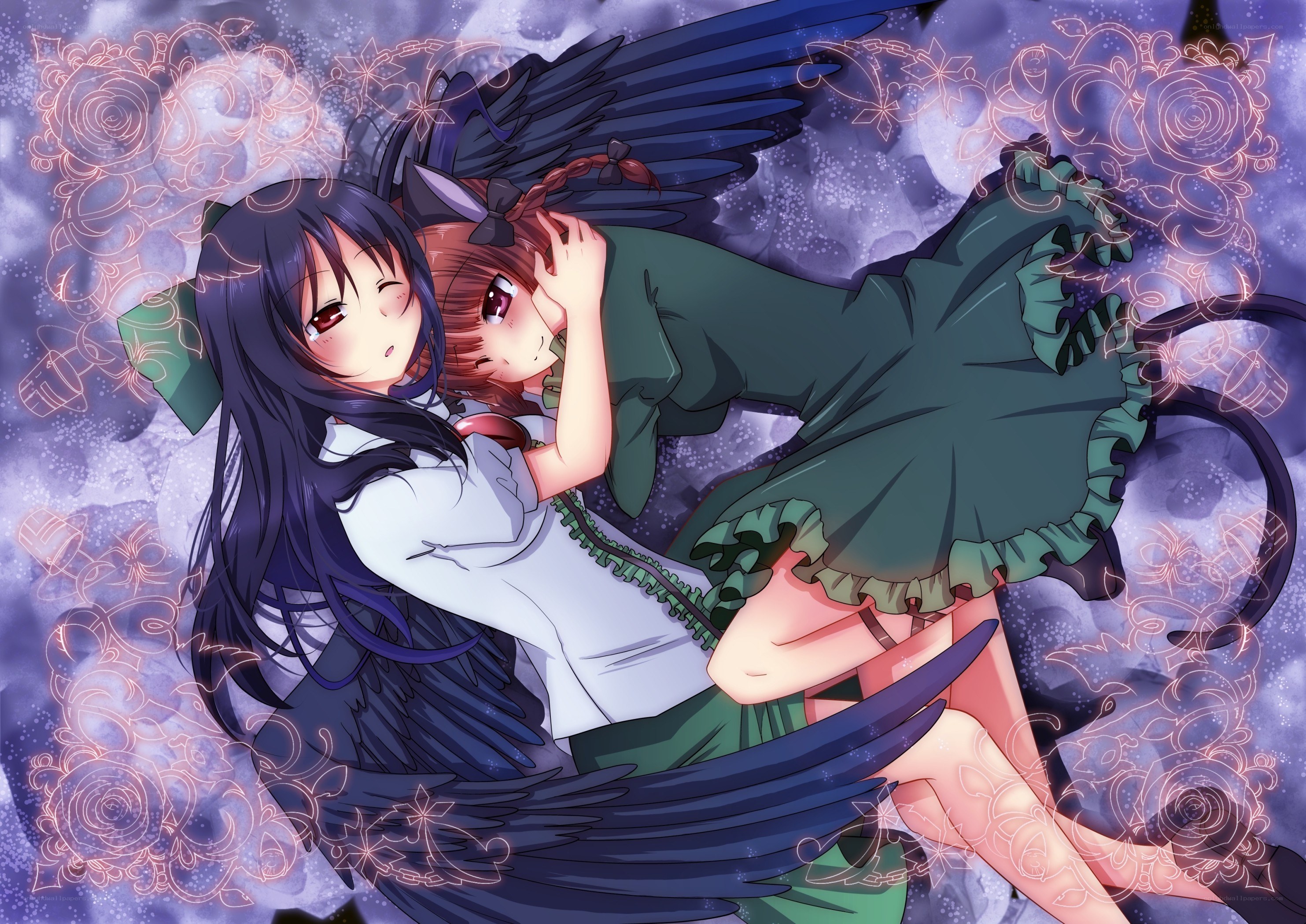 Two girls with wings embracing