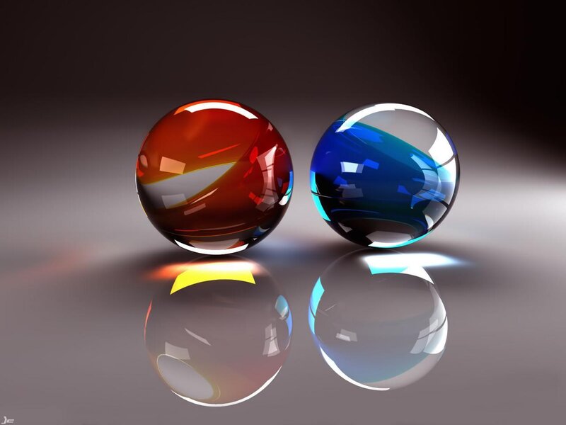 Two glass spheres on reflective surface