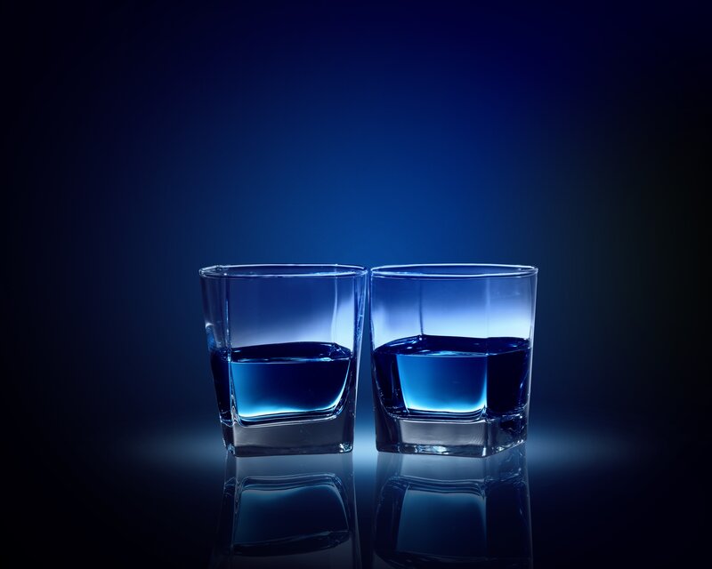 Two glasses of blue liquid