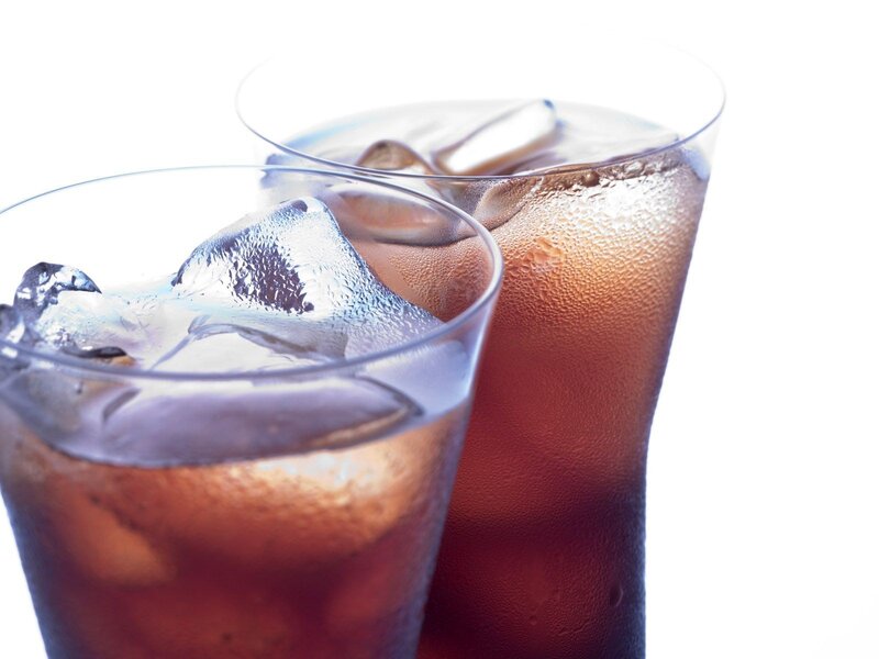 two glasses of cola with ice