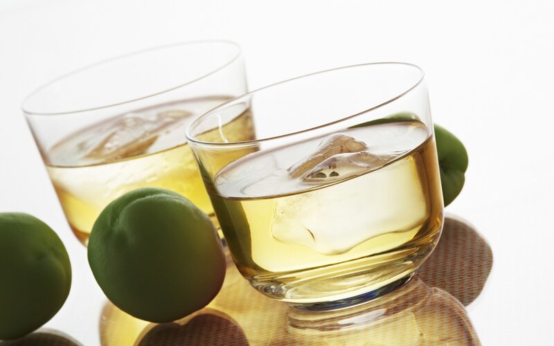 Two glasses of whiskey with ice