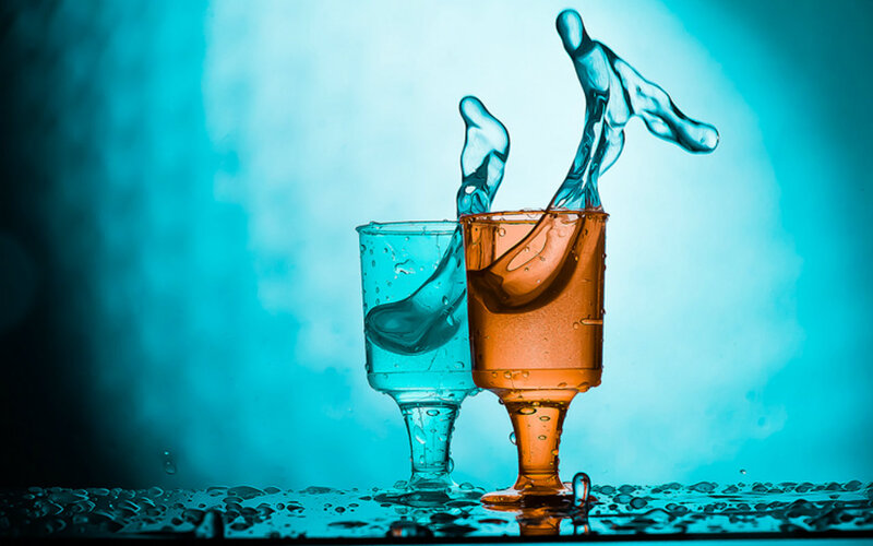 Two Glasses with Liquid Splashes