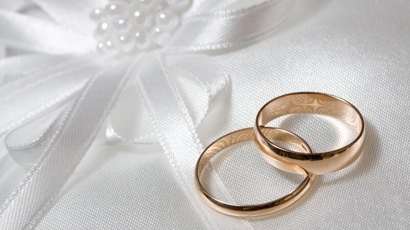 Two Gold Wedding Rings — White, Serene, Photograph