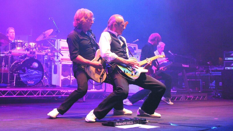 Two Guitarists on Stage — Purple