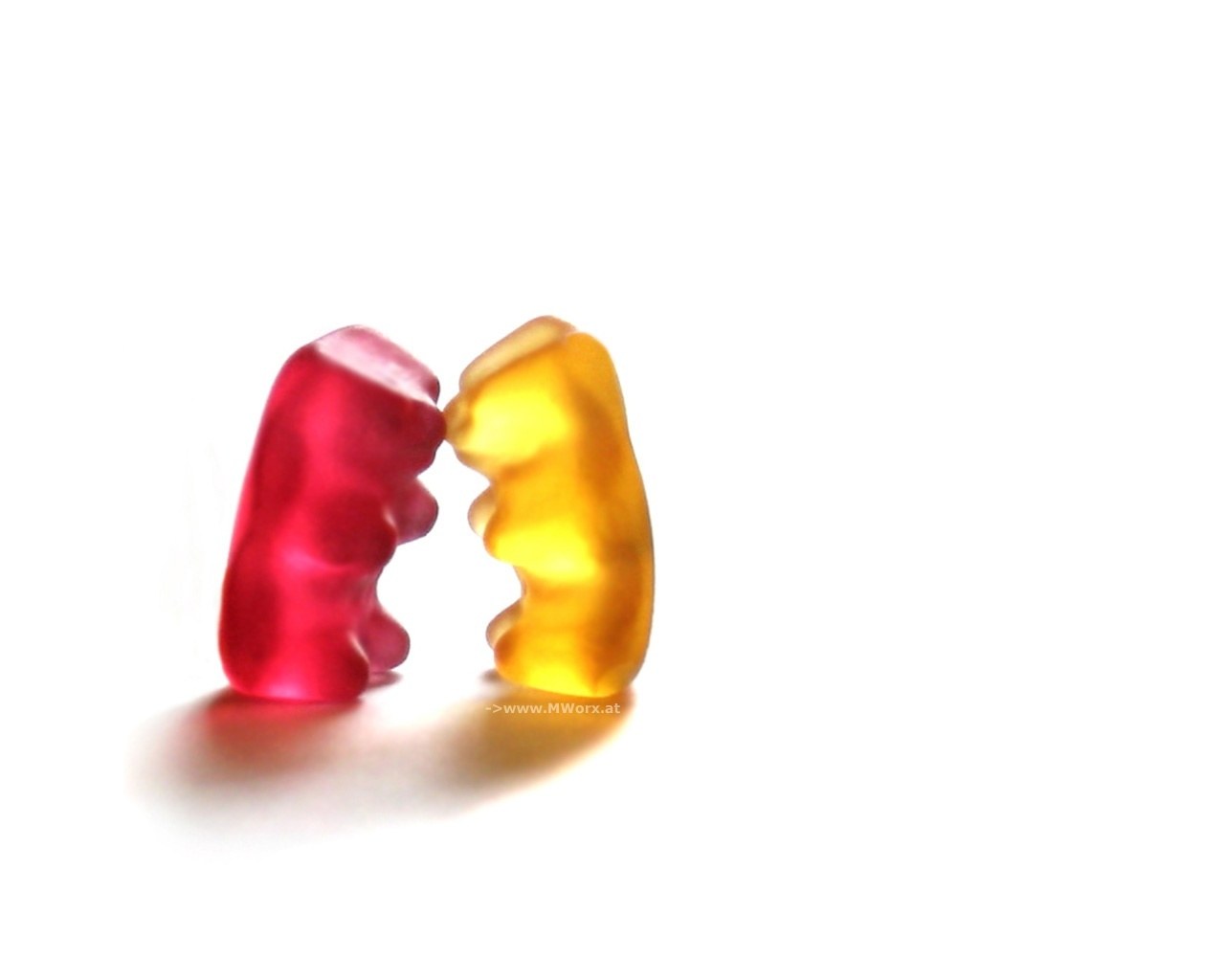 Two gummy bears facing each other
