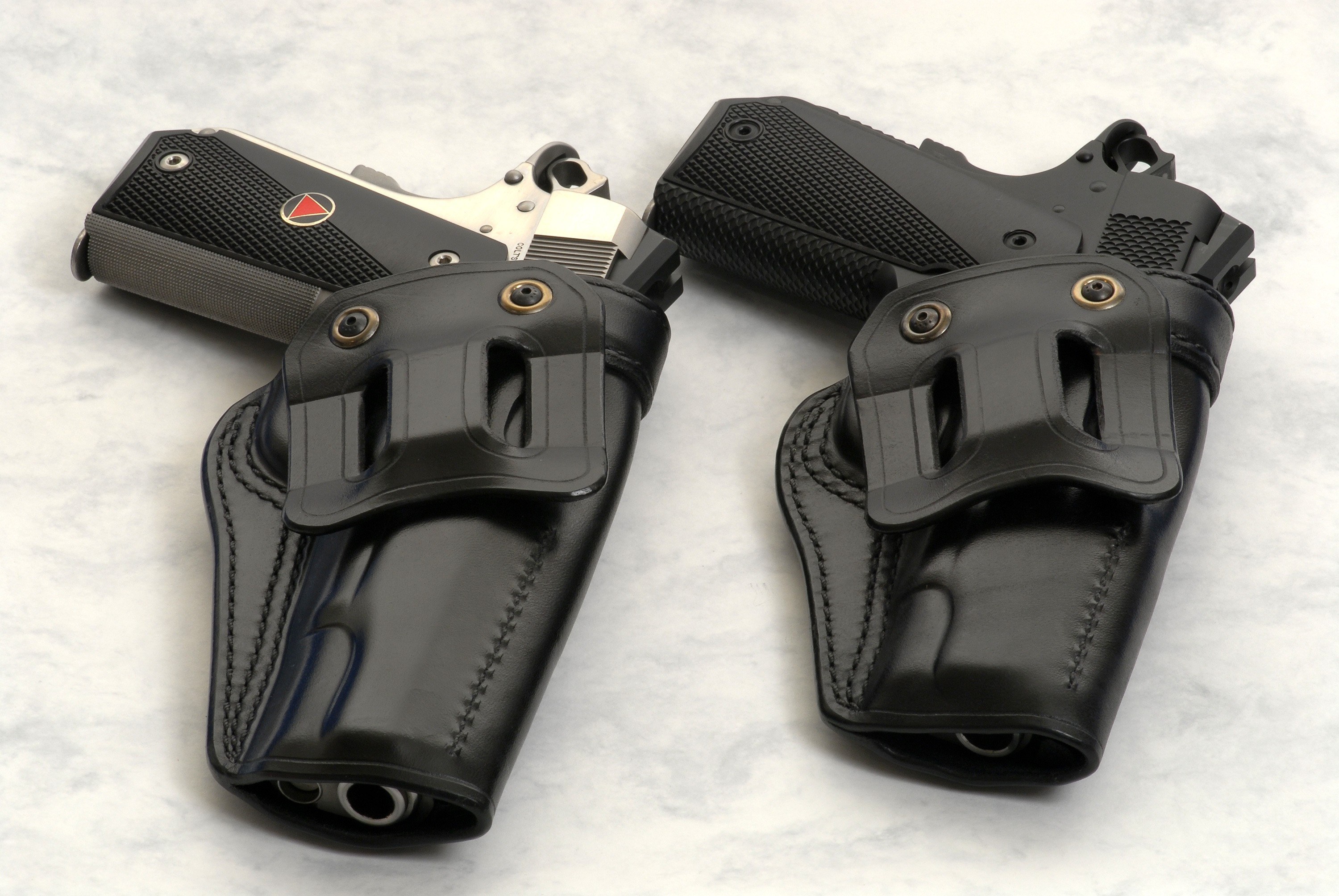 two handguns in holsters