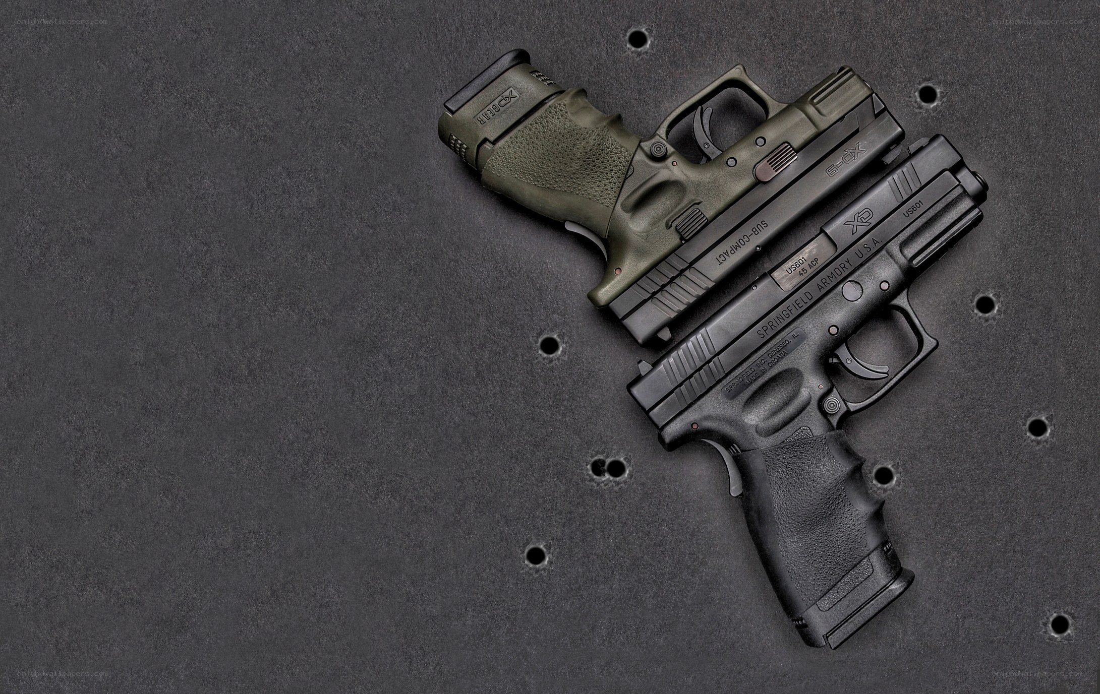 Two handguns on a target