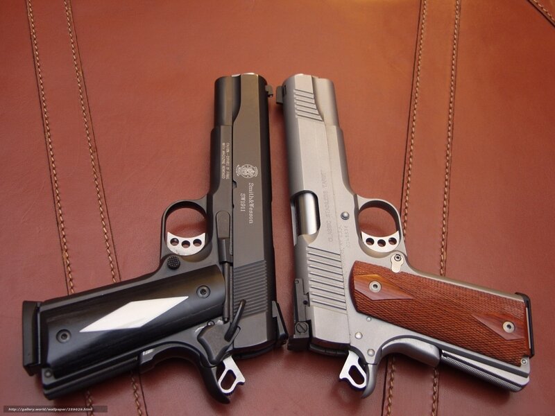 Two handguns on leather