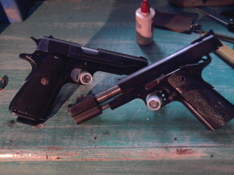 Two Handguns on Table — Green