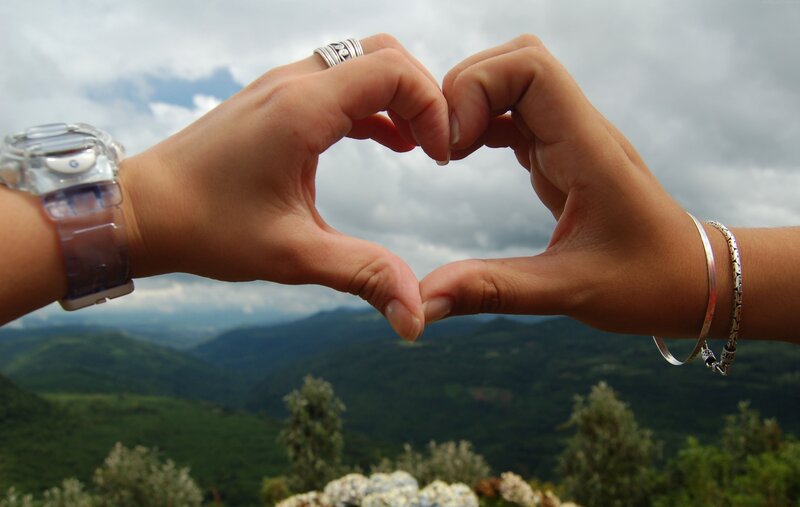 Two Hands Forming Heart — Green, Peaceful