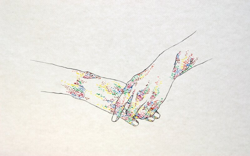 two hands holding each other