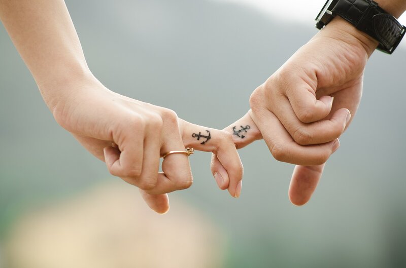 Two Hands Holding Fingers — White