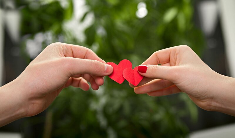 Two Hands Holding Hearts — Red