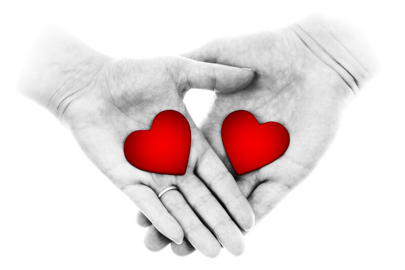 Two Hands Holding Hearts