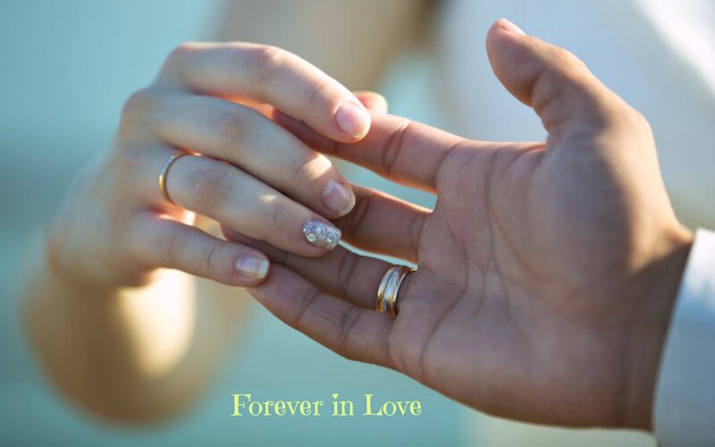 Two Hands Holding Rings