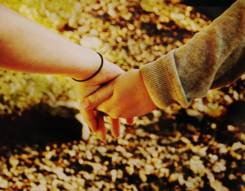 Two Hands Holding — Yellow, Warm