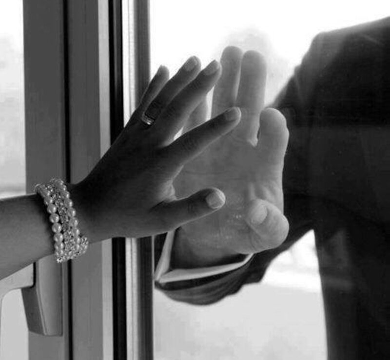 Two Hands Touching Glass