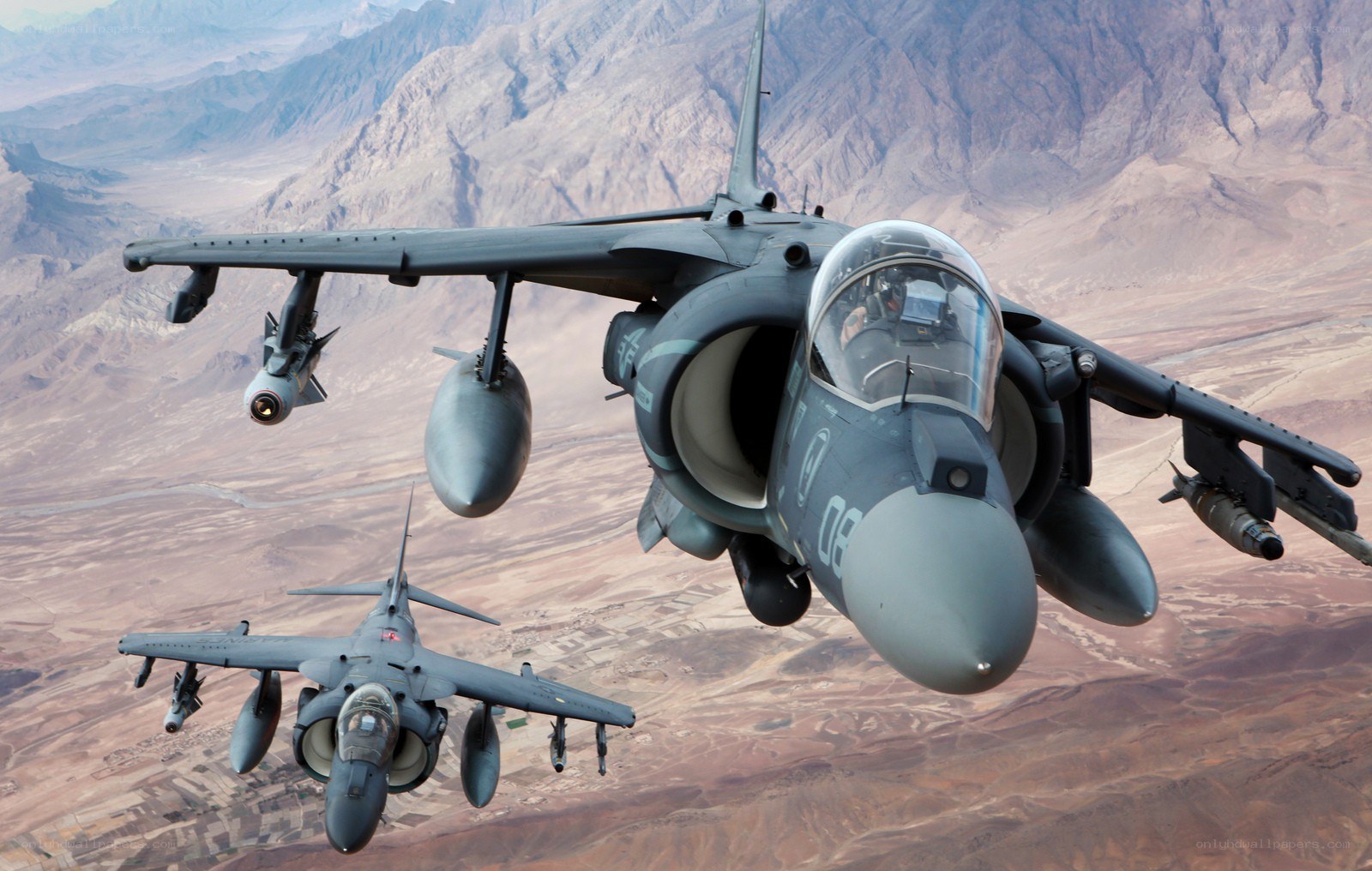 Two Harrier jets in flight