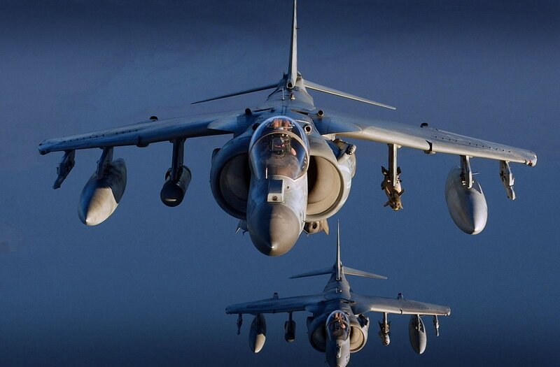 Two Harrier jets in flight