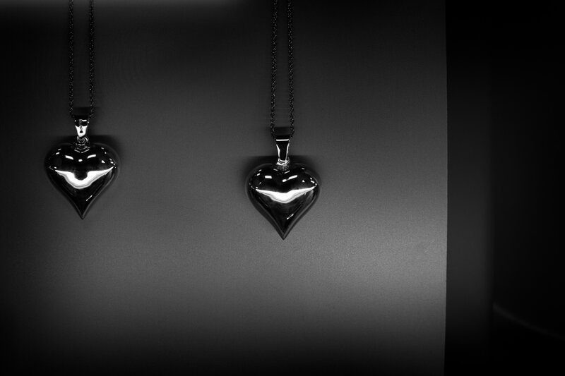 Two heart-shaped pendants