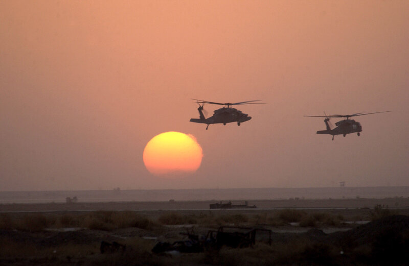 Two Helicopters Flying — Orange