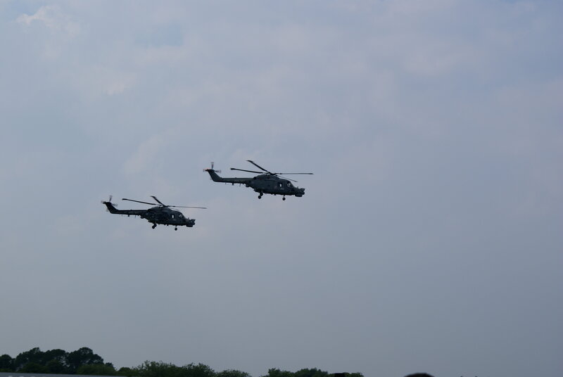 Two helicopters in flight