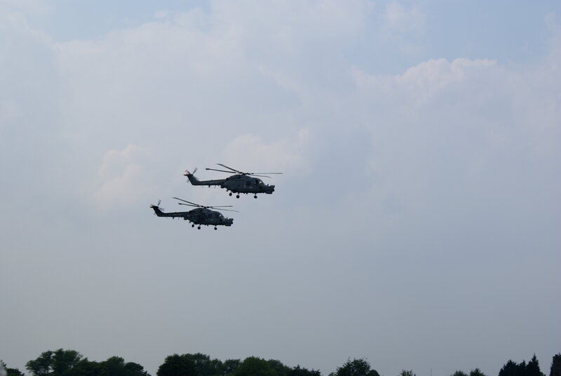 Two helicopters in flight