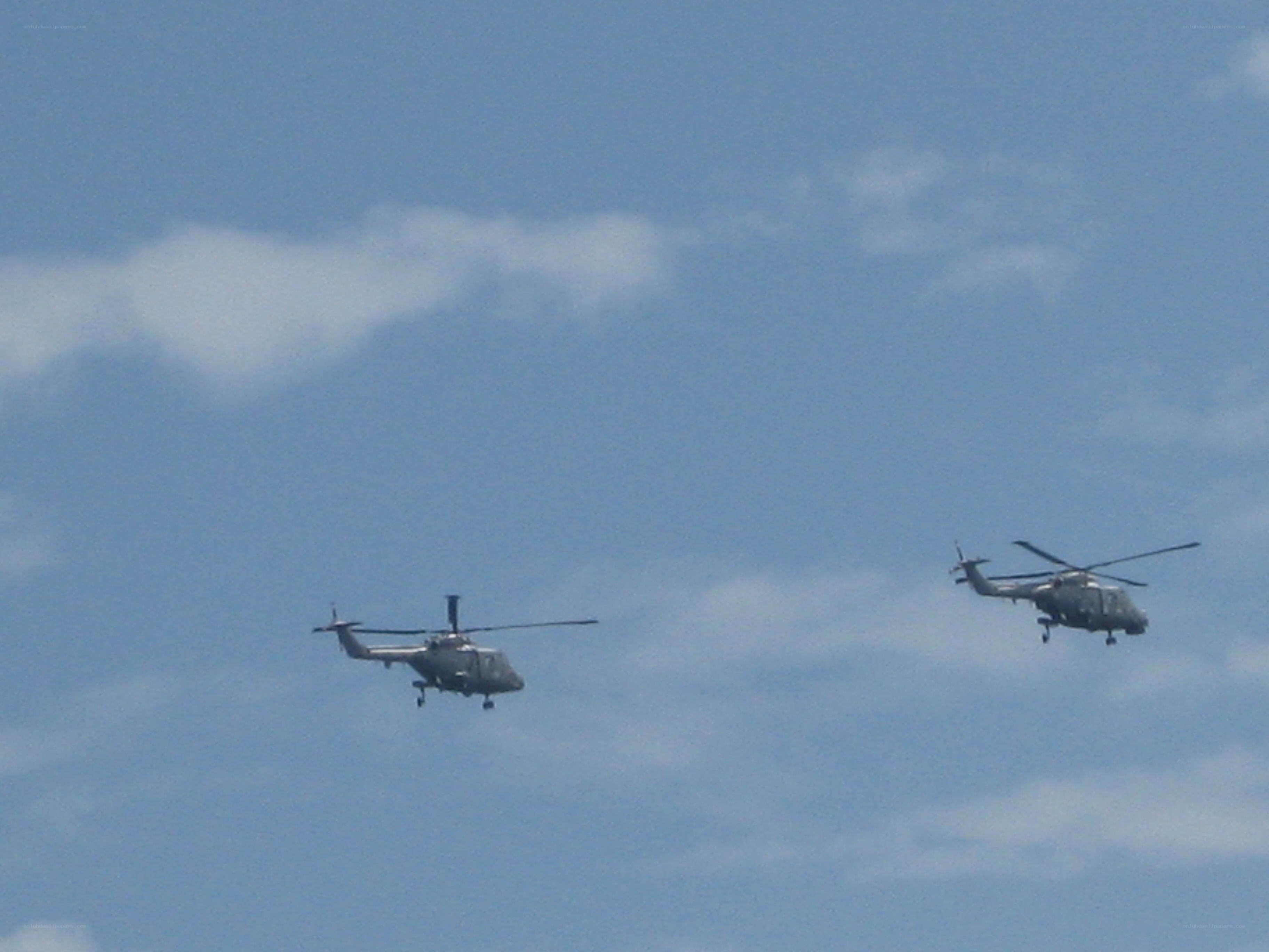Two helicopters in flight