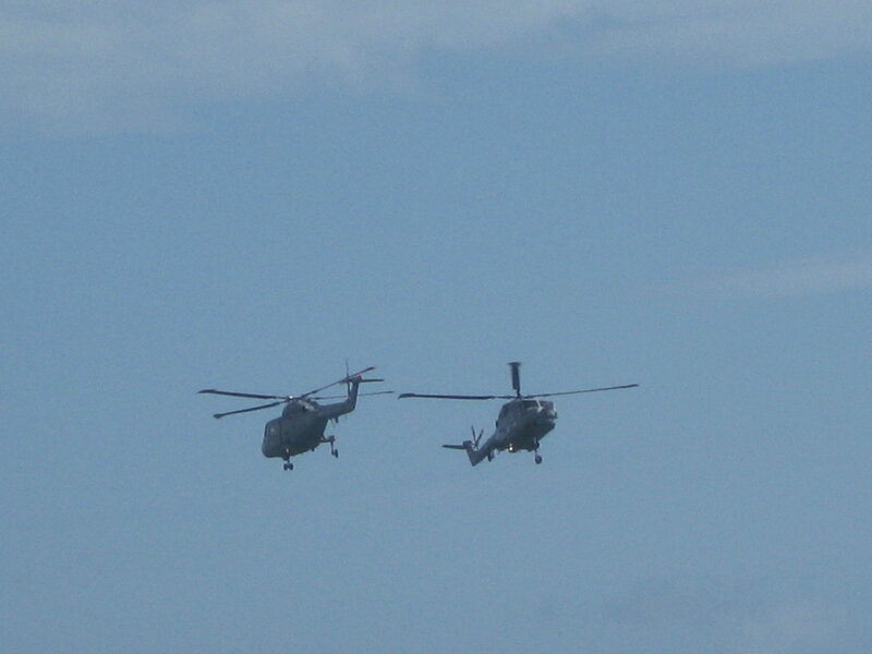 Two helicopters in flight