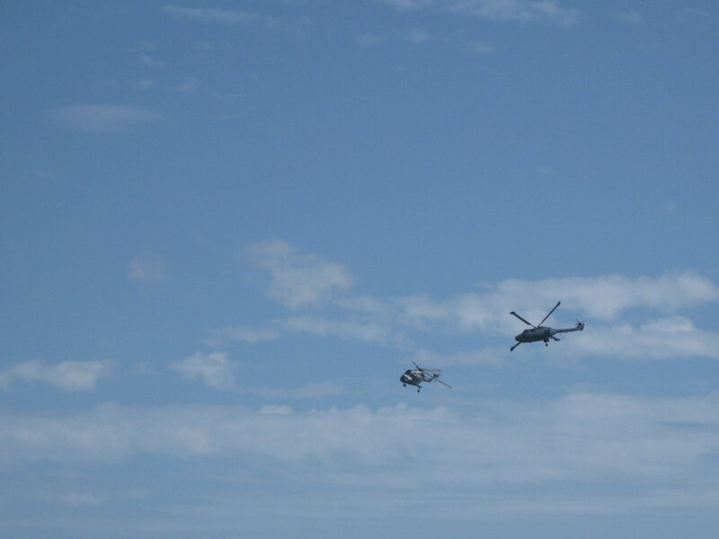 Two helicopters in the sky