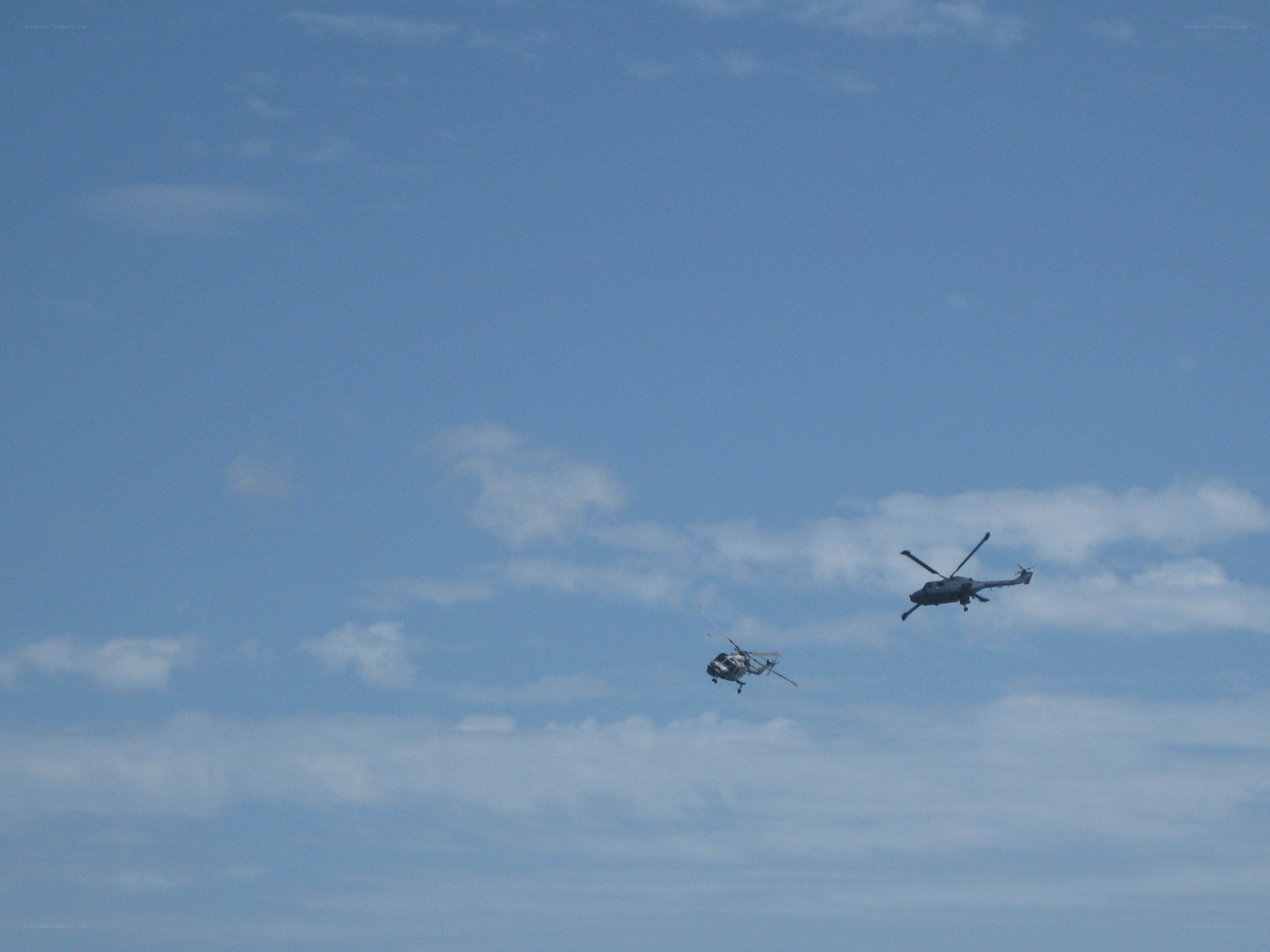 Two helicopters in the sky