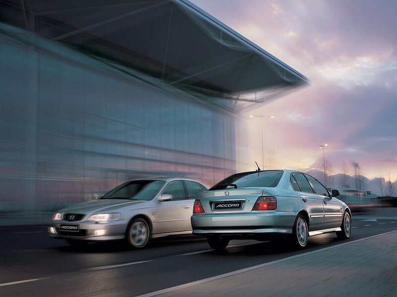Two Honda Accords in motion