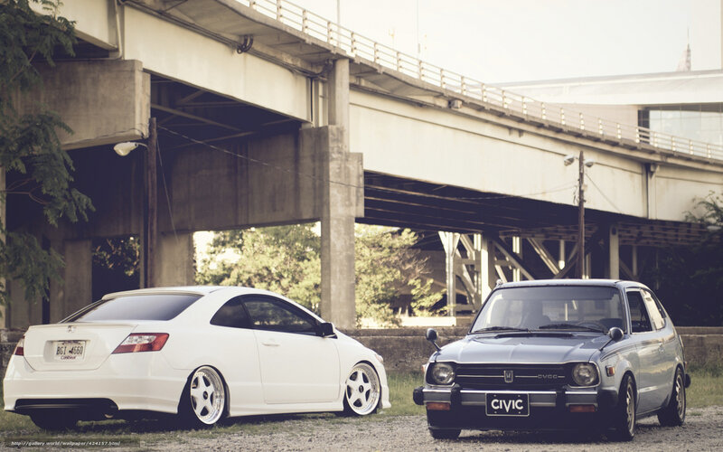 Two Honda Civics under a bridge