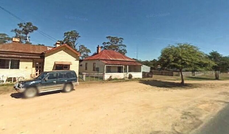 Two Houses on Dirt Road