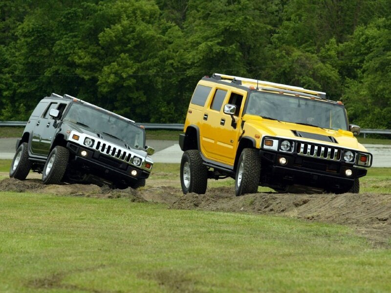 Two Hummer Suvs — Yellow