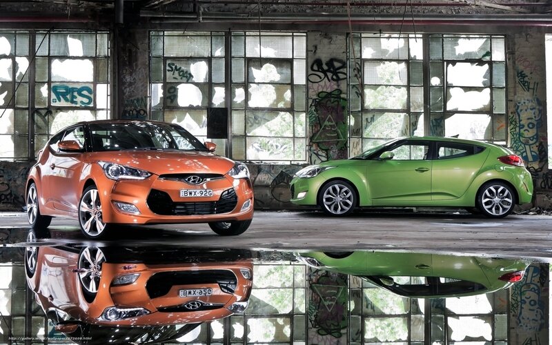 Two Hyundai Veloster cars in warehouse