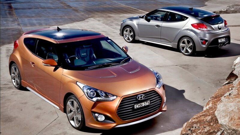 Two Hyundai Veloster Cars — Orange