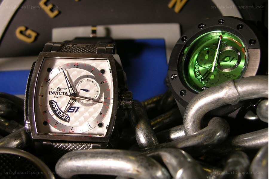 Two Invicta watches on chains
