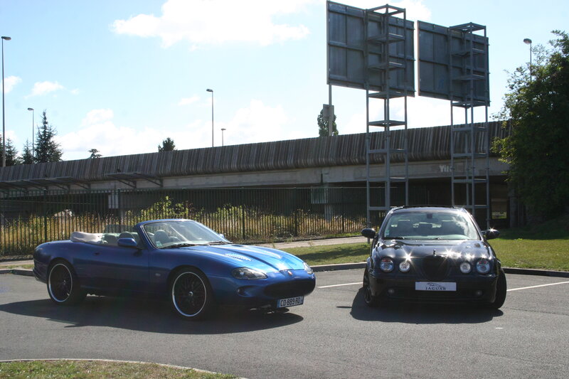 Two Jaguar Cars — Blue